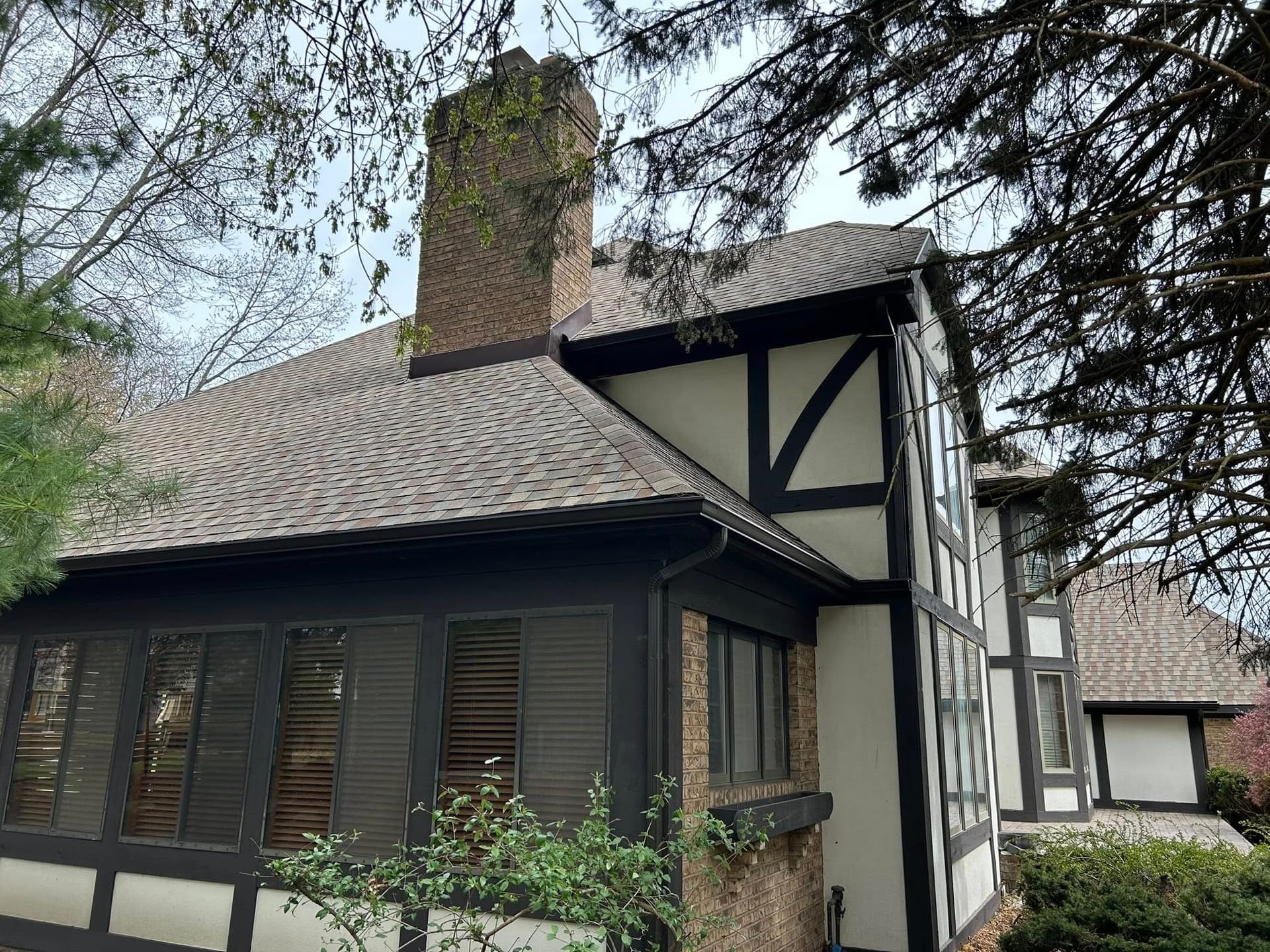Gutter system with color-matched downspouts